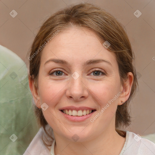 Joyful white young-adult female with medium  brown hair and blue eyes