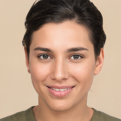 Joyful white young-adult female with short  brown hair and brown eyes