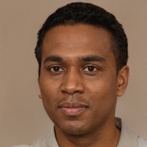 Neutral black young-adult male with short  black hair and brown eyes