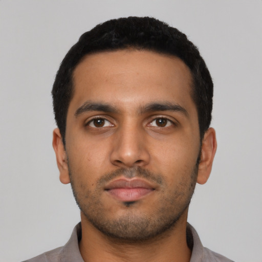 Neutral latino young-adult male with short  black hair and brown eyes