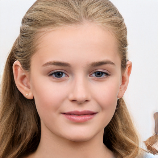 Joyful white child female with long  brown hair and brown eyes