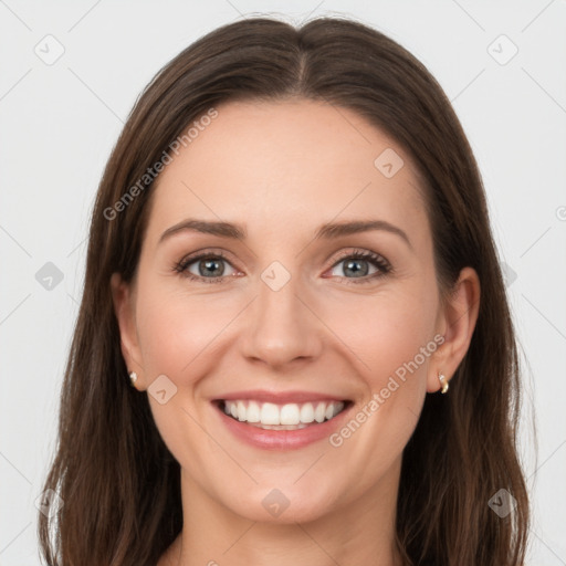 Joyful white young-adult female with long  brown hair and grey eyes