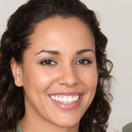 Joyful white young-adult female with medium  brown hair and brown eyes