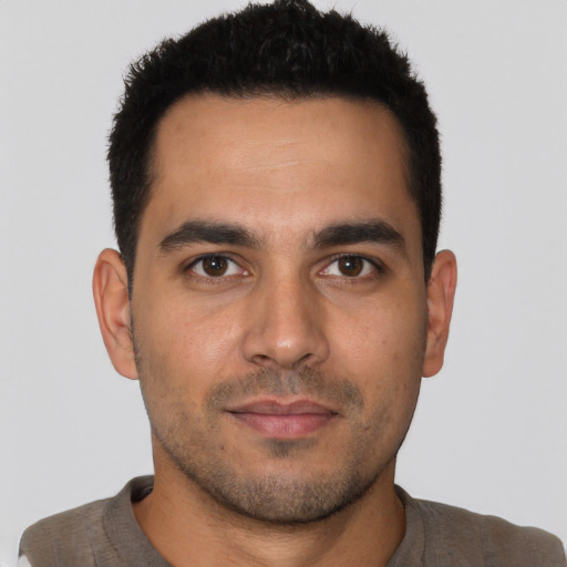 Neutral latino young-adult male with short  brown hair and brown eyes