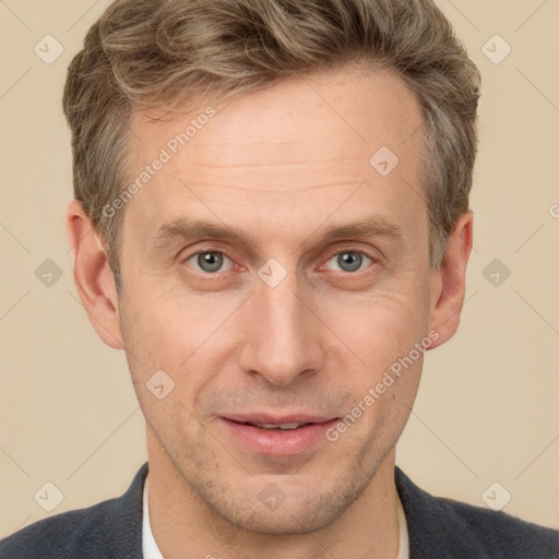 Joyful white adult male with short  brown hair and grey eyes