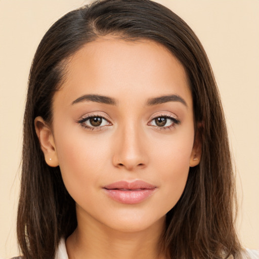 Joyful white young-adult female with long  brown hair and brown eyes