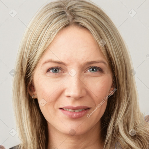 Joyful white young-adult female with long  brown hair and blue eyes