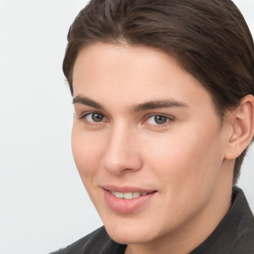 Joyful white young-adult female with short  brown hair and brown eyes