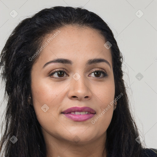 Joyful latino young-adult female with long  brown hair and brown eyes