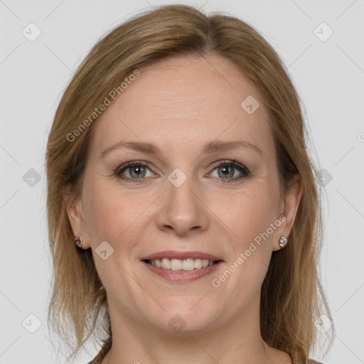 Joyful white adult female with medium  brown hair and grey eyes