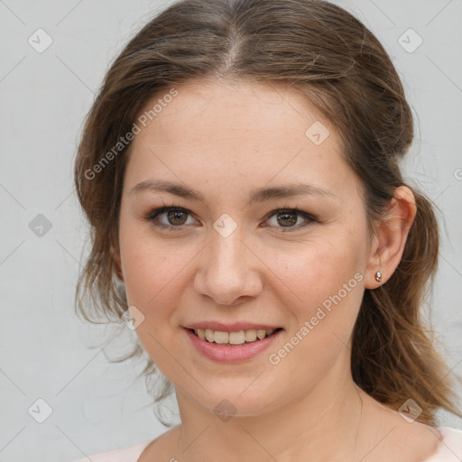 Joyful white young-adult female with medium  brown hair and grey eyes