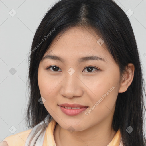 Joyful asian young-adult female with long  brown hair and brown eyes