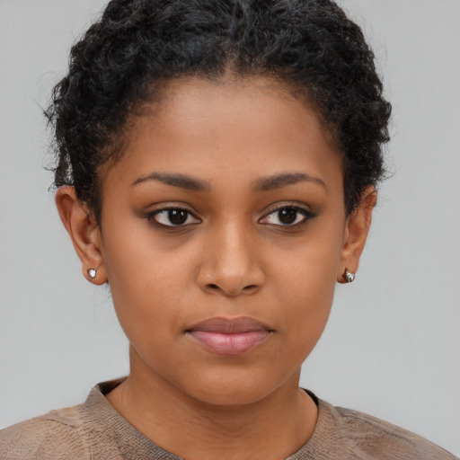 Neutral black child female with short  brown hair and brown eyes