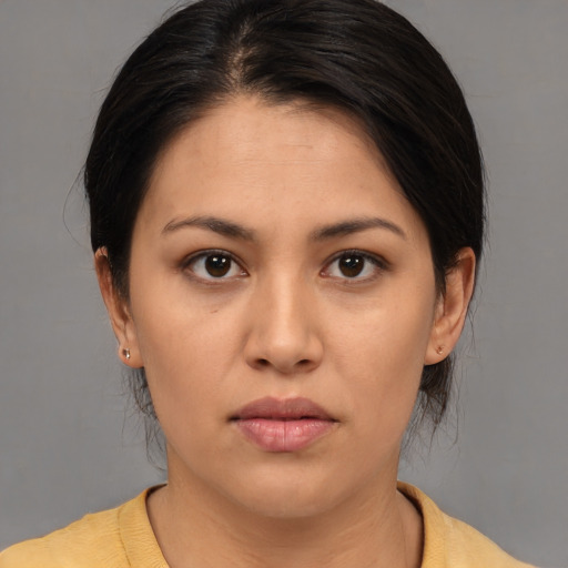 Joyful asian young-adult female with medium  brown hair and brown eyes