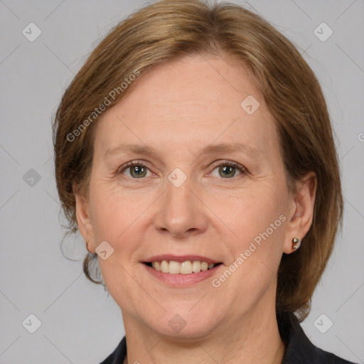 Joyful white adult female with medium  brown hair and grey eyes