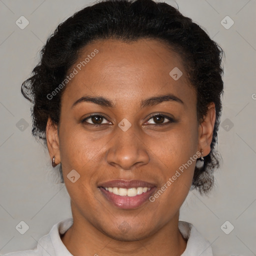 Joyful black young-adult female with short  brown hair and brown eyes