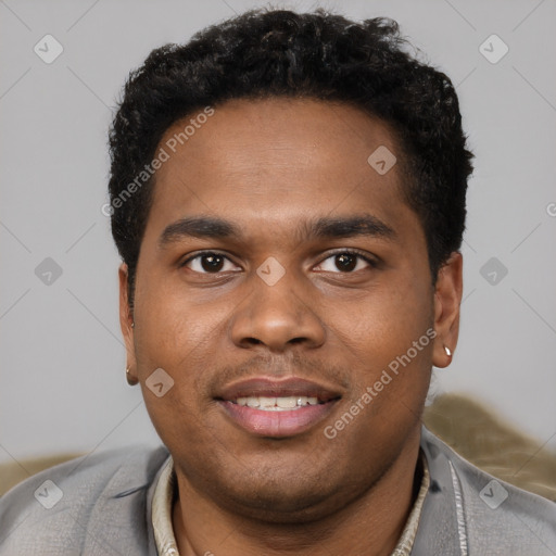 Joyful black young-adult male with short  brown hair and brown eyes