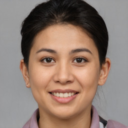 Joyful asian young-adult female with medium  brown hair and brown eyes