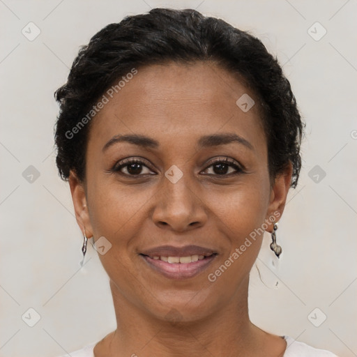 Joyful black adult female with short  brown hair and brown eyes