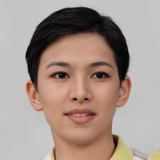 Joyful asian young-adult female with short  brown hair and brown eyes