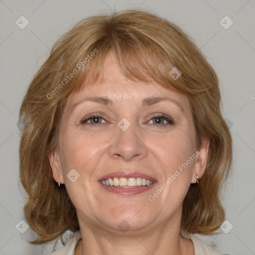 Joyful white adult female with medium  brown hair and blue eyes