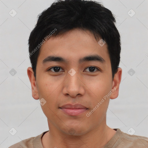 Joyful asian young-adult male with short  brown hair and brown eyes