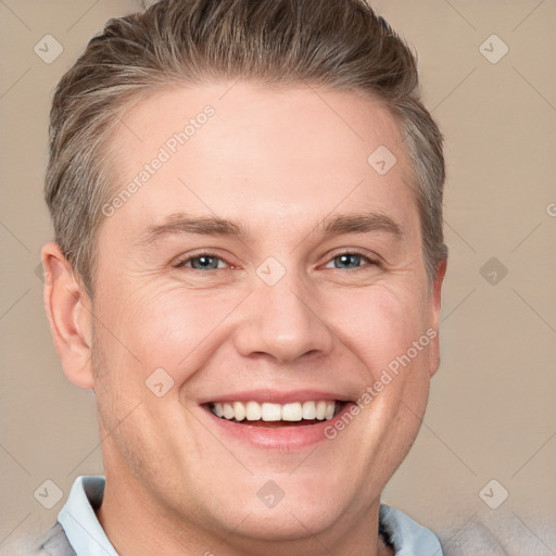 Joyful white adult male with short  brown hair and grey eyes