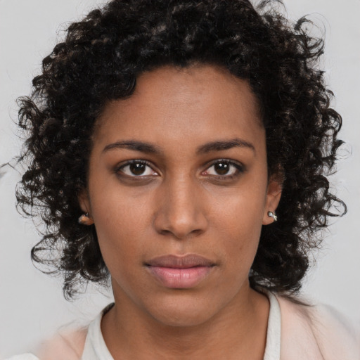 Neutral black young-adult female with long  brown hair and brown eyes