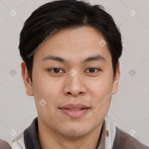 Joyful asian young-adult male with short  brown hair and brown eyes