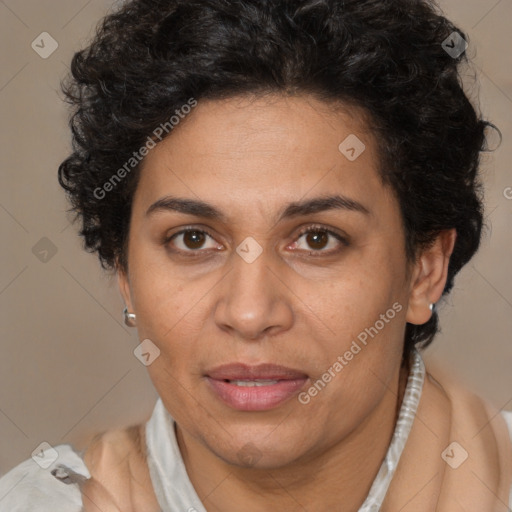 Joyful latino adult female with short  brown hair and brown eyes