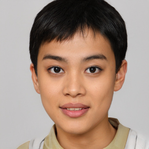 Joyful asian young-adult female with short  brown hair and brown eyes
