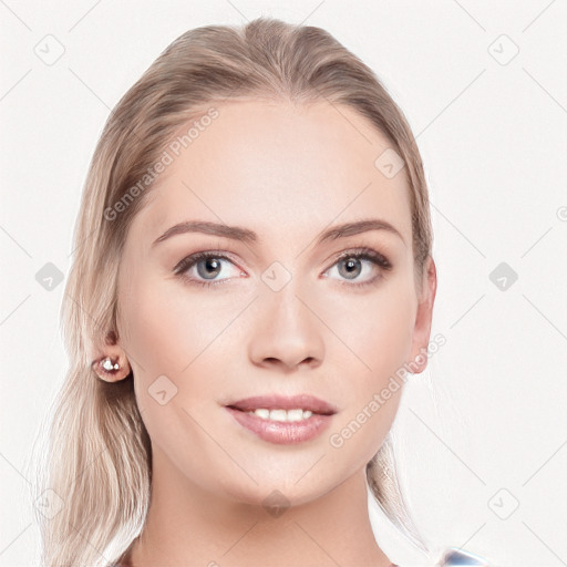 Joyful white young-adult female with long  brown hair and blue eyes