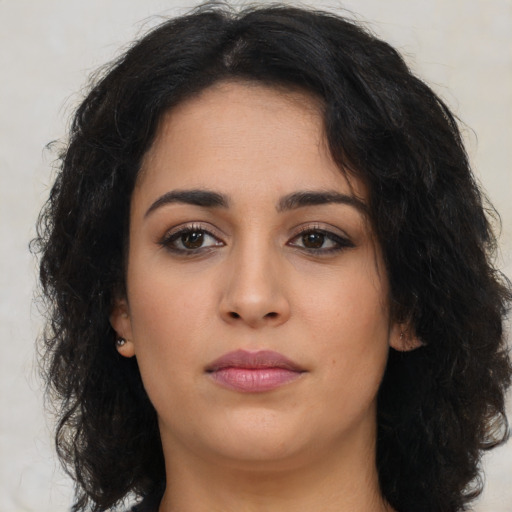 Neutral latino young-adult female with long  brown hair and brown eyes