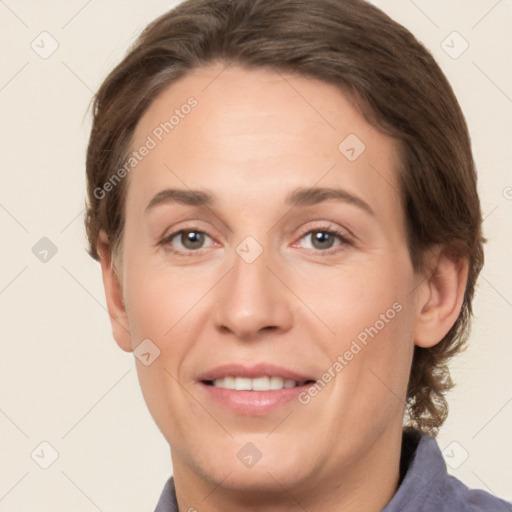 Joyful white adult female with short  brown hair and brown eyes