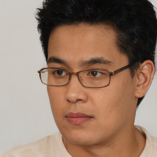 Neutral asian young-adult male with short  black hair and brown eyes