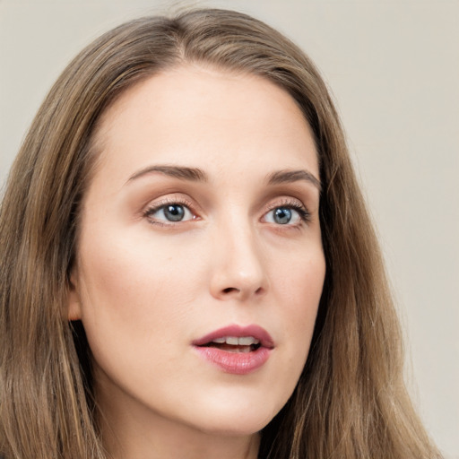 Neutral white young-adult female with long  brown hair and grey eyes