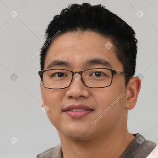 Joyful asian young-adult male with short  black hair and brown eyes