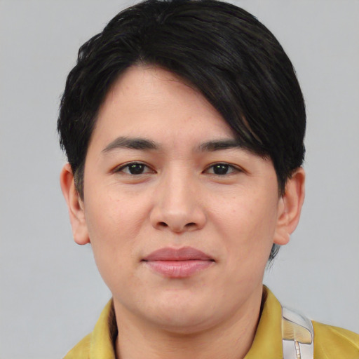 Joyful asian young-adult male with short  black hair and brown eyes