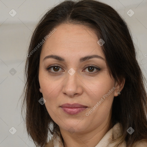 Joyful white adult female with long  brown hair and brown eyes