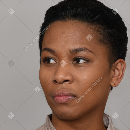 Joyful black young-adult female with short  black hair and brown eyes