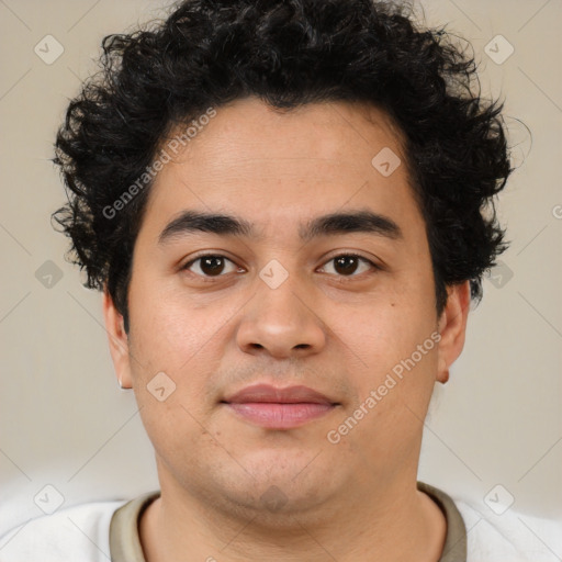 Joyful latino young-adult male with short  brown hair and brown eyes