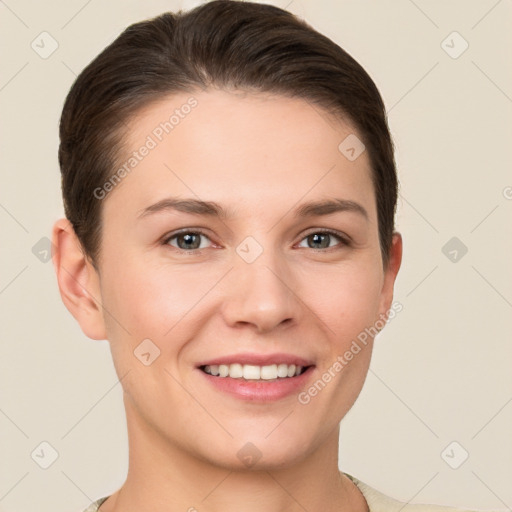 Joyful white young-adult female with short  brown hair and grey eyes