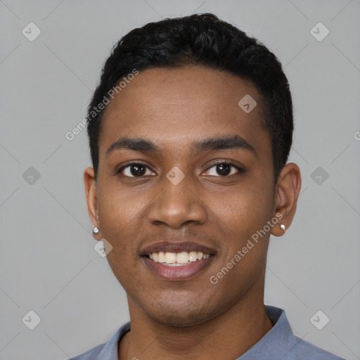 Joyful black young-adult male with short  black hair and brown eyes