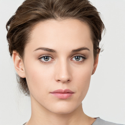 Neutral white young-adult female with medium  brown hair and grey eyes