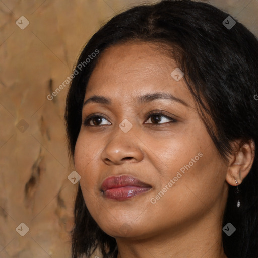 Joyful black adult female with medium  brown hair and brown eyes