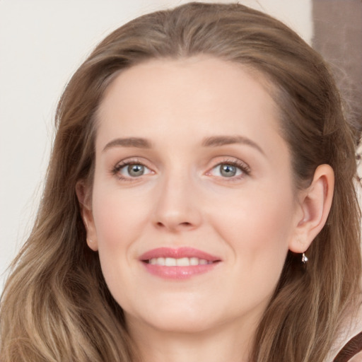 Joyful white young-adult female with long  brown hair and grey eyes