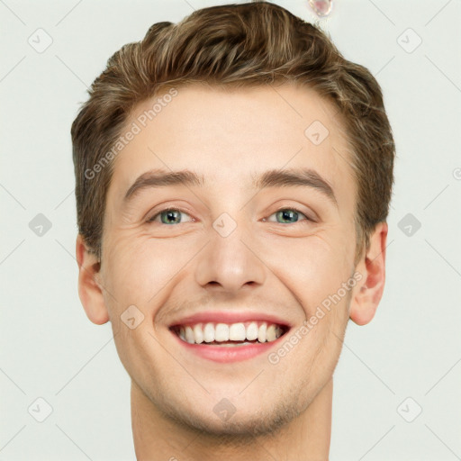 Joyful white young-adult male with short  brown hair and blue eyes