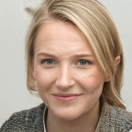 Joyful white young-adult female with medium  blond hair and grey eyes