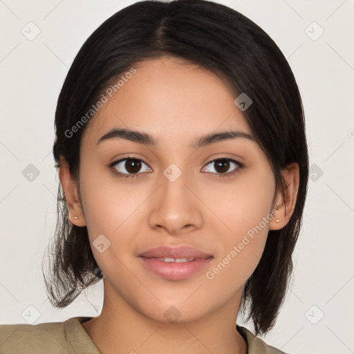 Joyful latino young-adult female with medium  brown hair and brown eyes