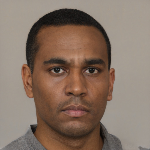 Neutral black young-adult male with short  black hair and brown eyes